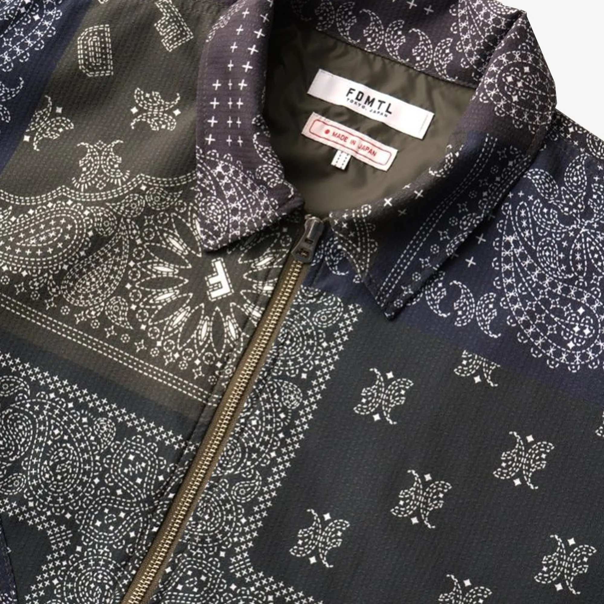 FDMTL | PRINTED PATCHWORK JACKET  { KHAKI